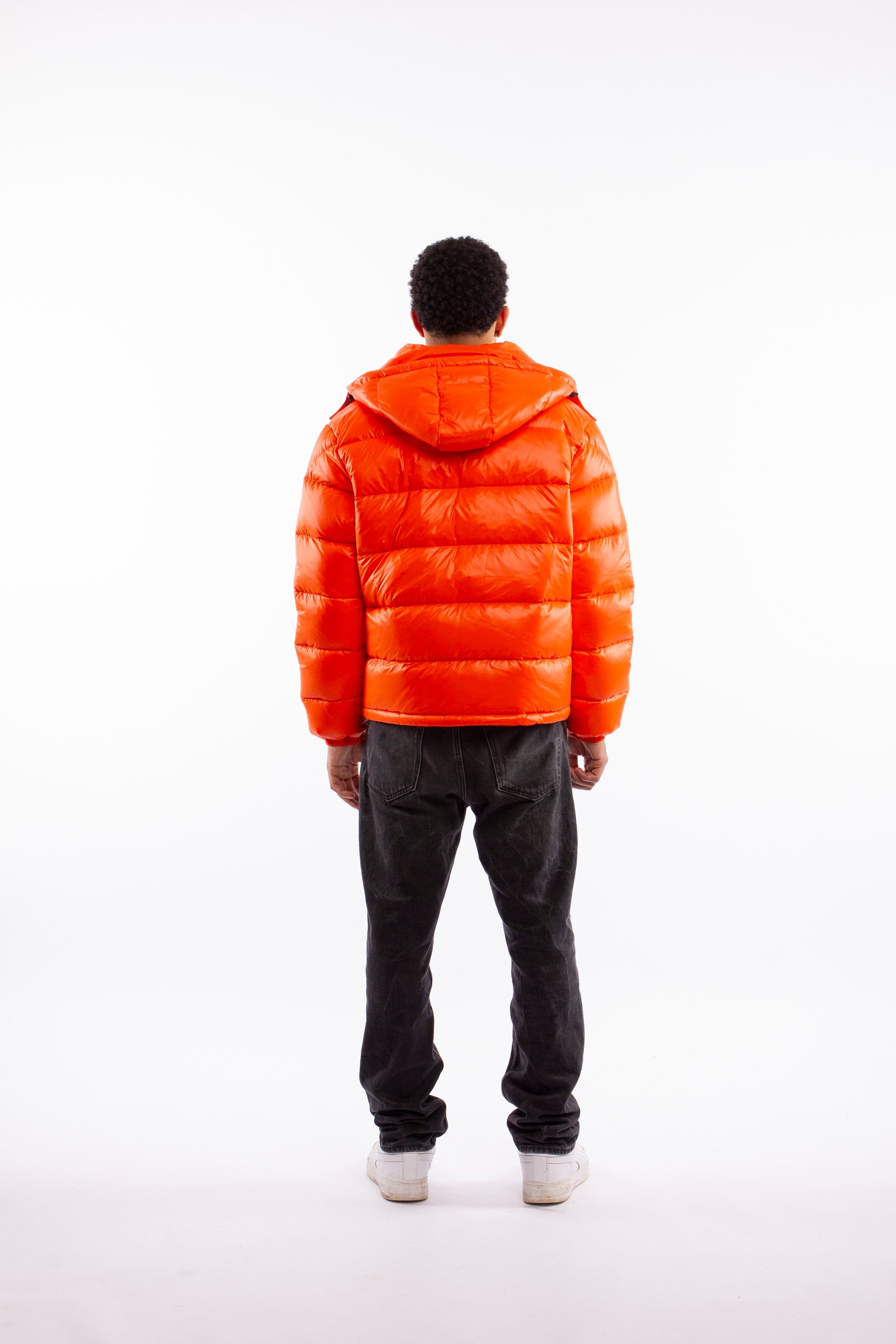 ARCÉVE The Mont Jacket - Rear view of the men's technical winter jacket - Orange