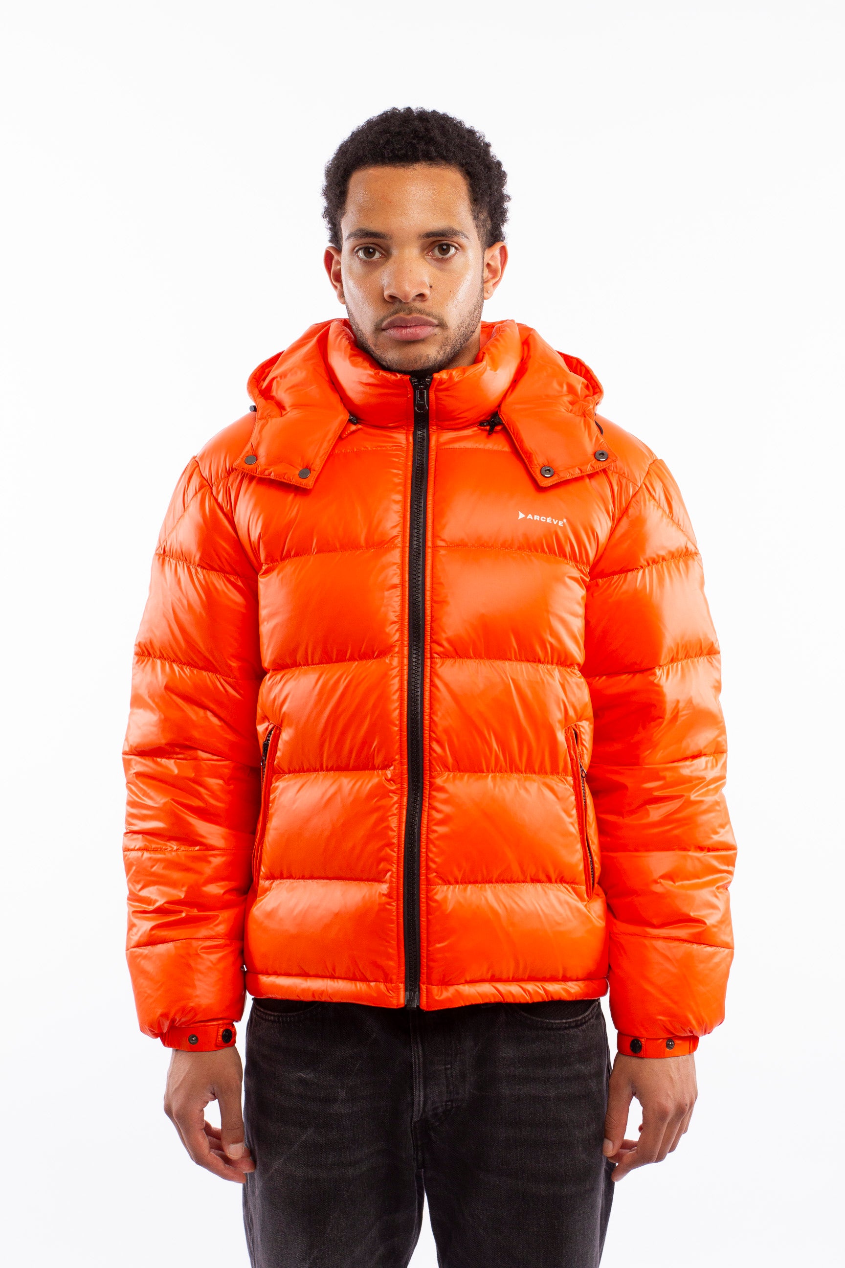 ARCÉVE The Mont Jacket - Close-up of the waterproof YKK zipper - Orange