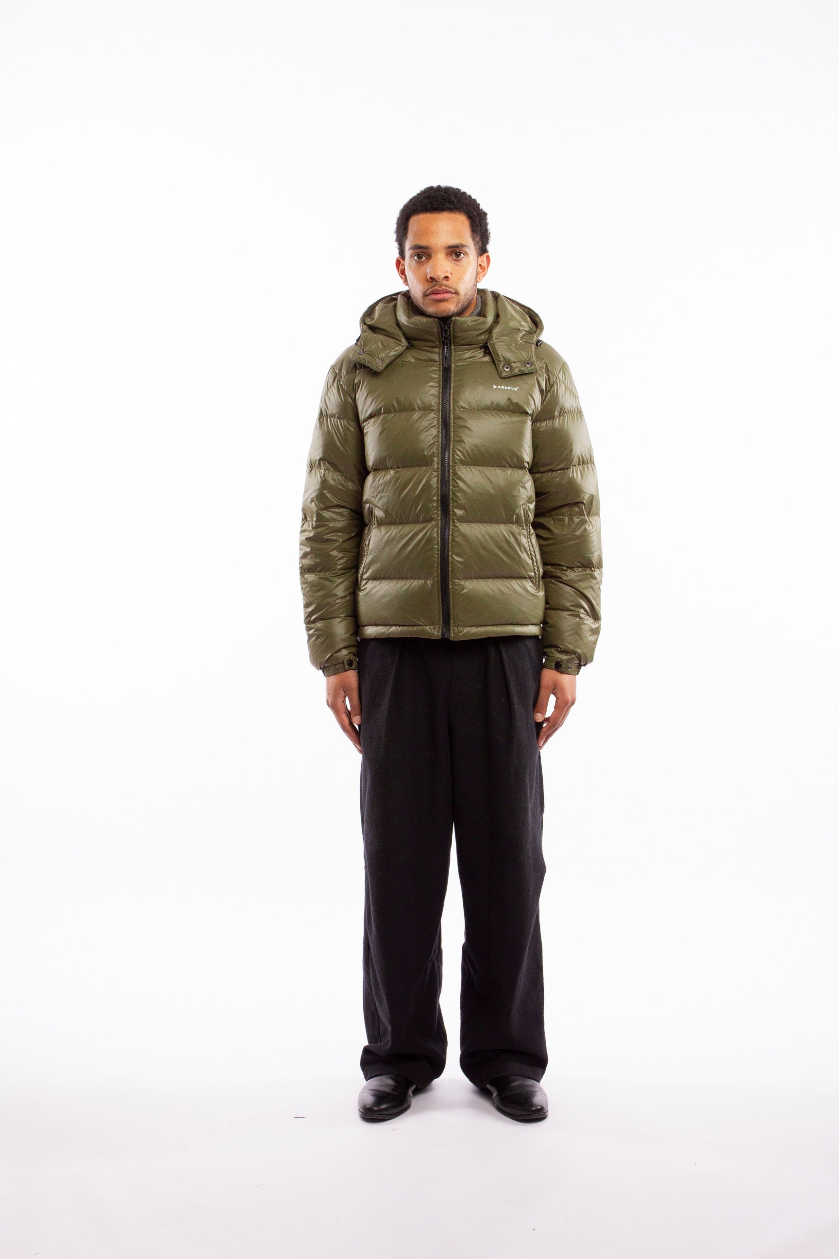ARCÉVE The Mont Jacket - Model wearing the premium down puffer jacket - Khaki